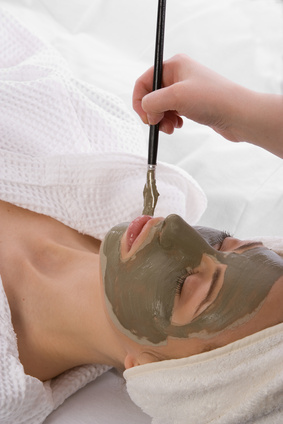 application of clay mask in a beauty center